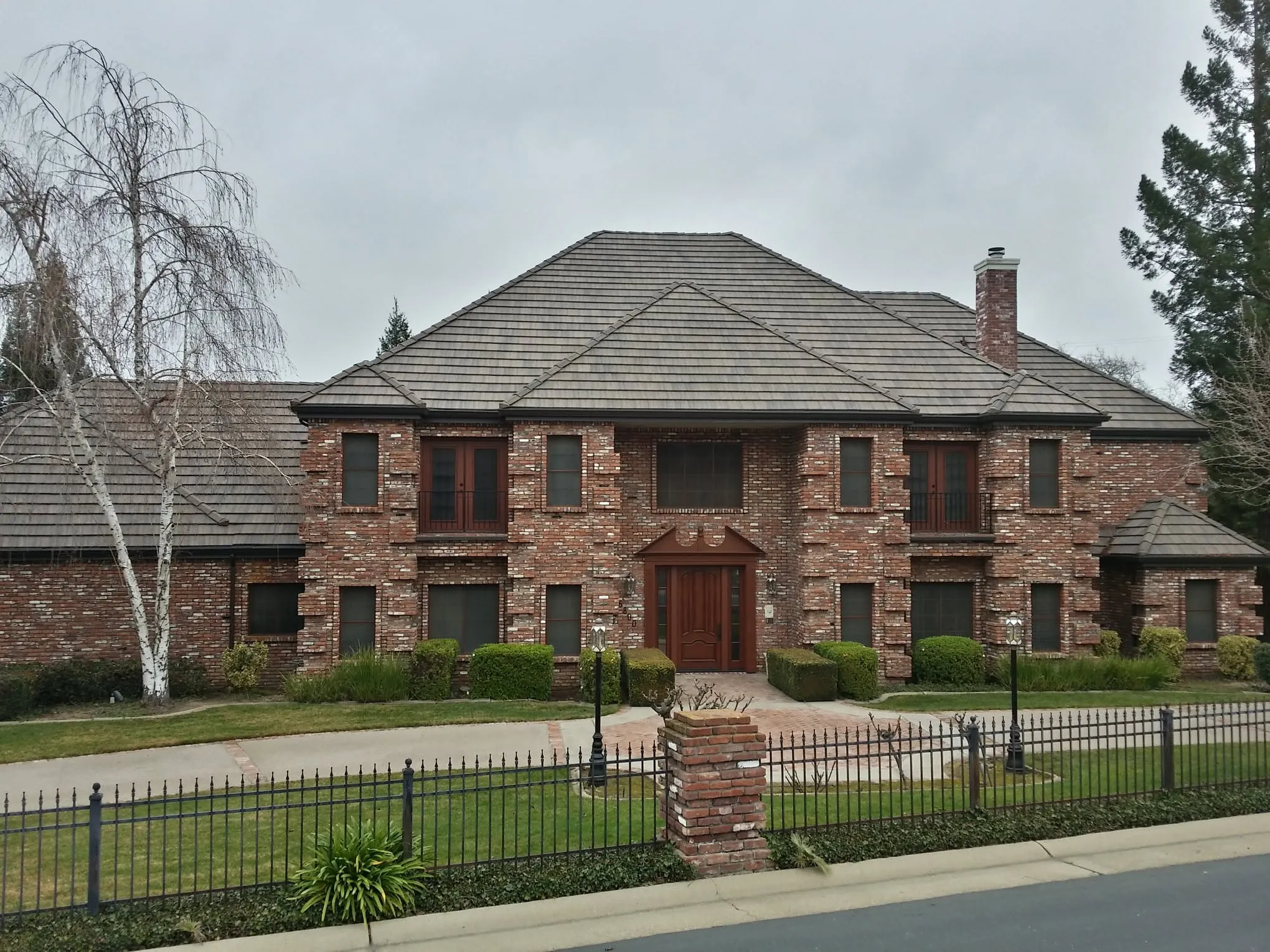 Large brick home with new tile roof in La Mesa CA – complete residential roof replacement services in East County San Diego